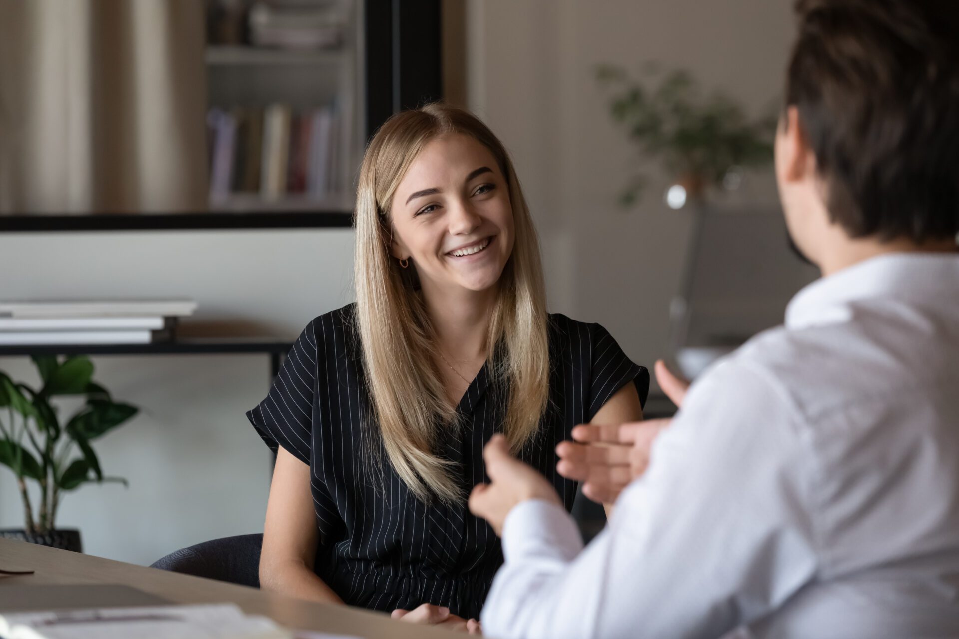 Smiling woman in job interview.